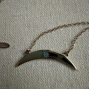 Kris Nations Silver crescent moon pendant w blue crystal star in center.  NWOT